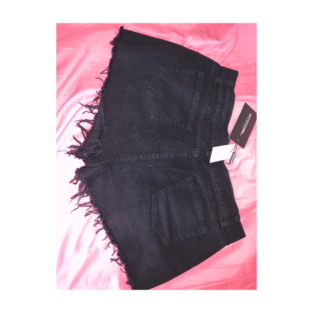 Black ripped shorts